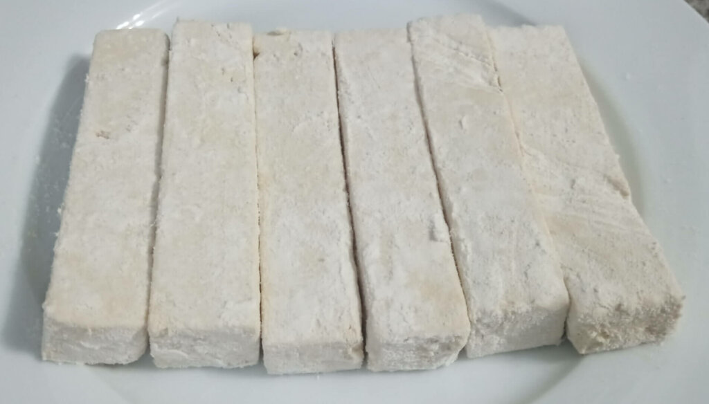 floured tofu sticks ready for breading